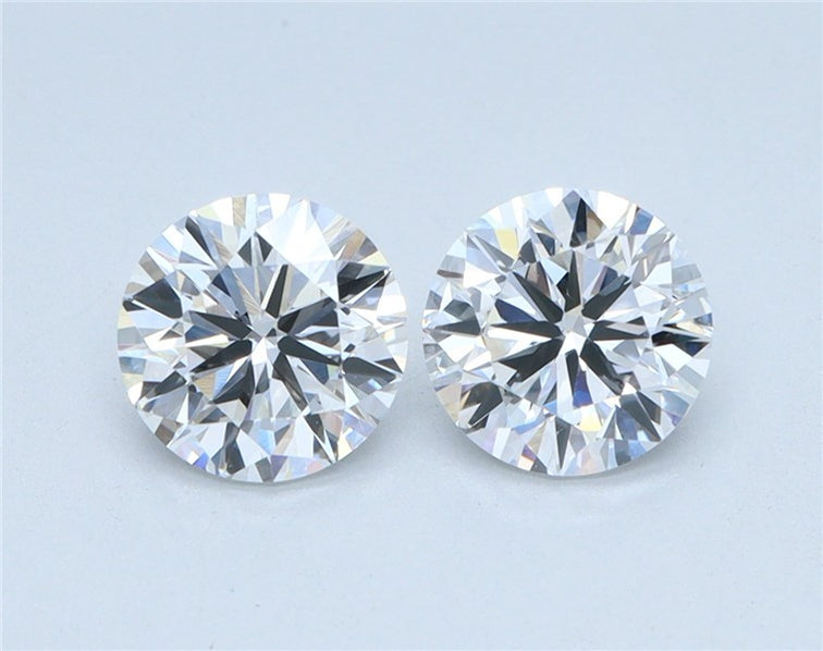 Matched pair of round diamonds shown rotating to display brilliance and matching proportions