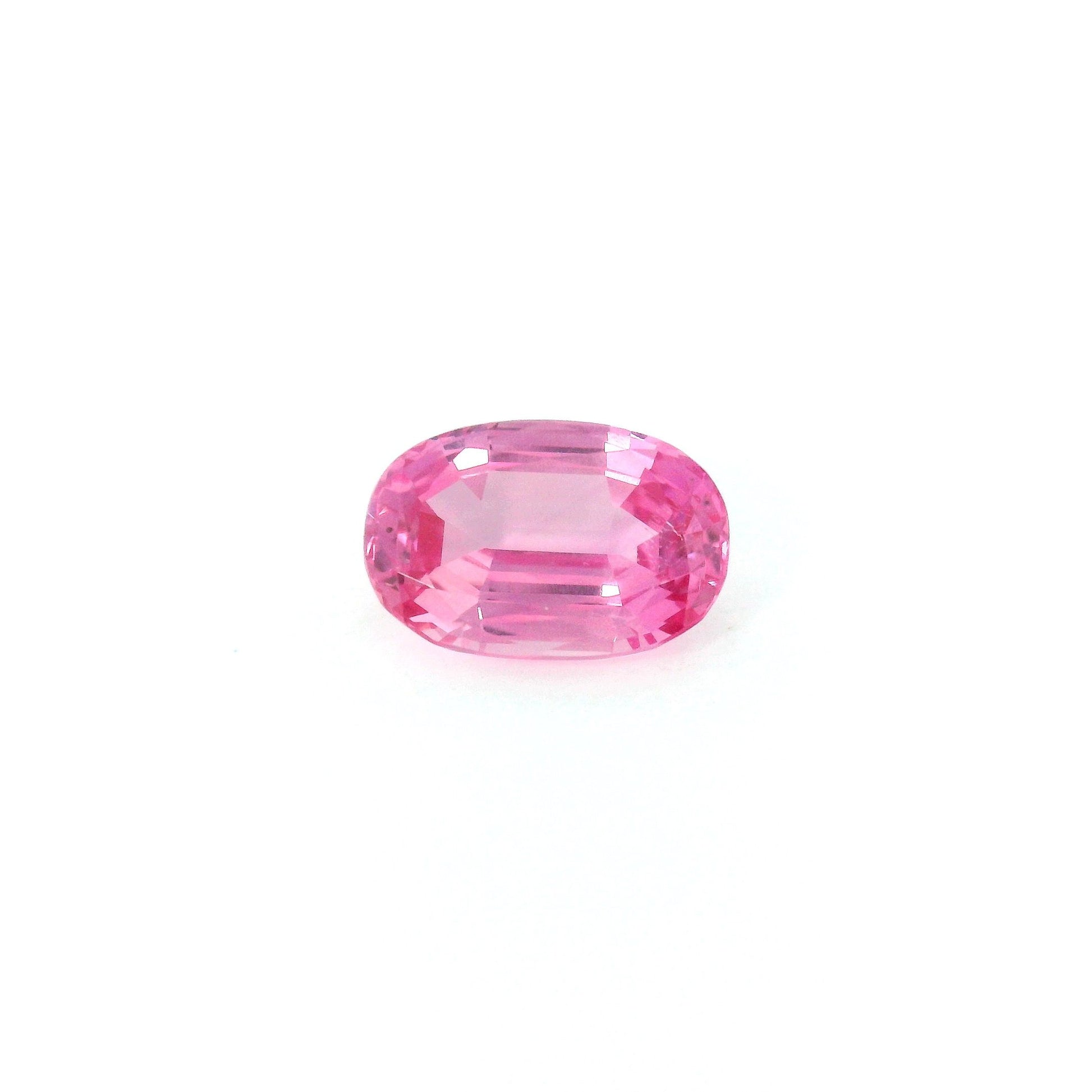 Loose oval vivid pink sapphire gemstone